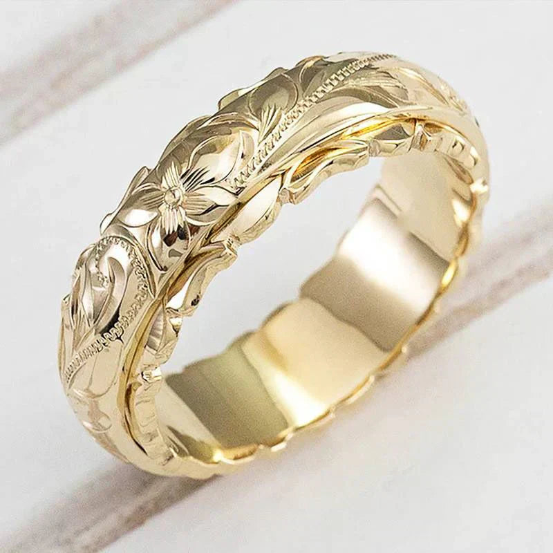 Anello con fiore in oro antico | Oro
